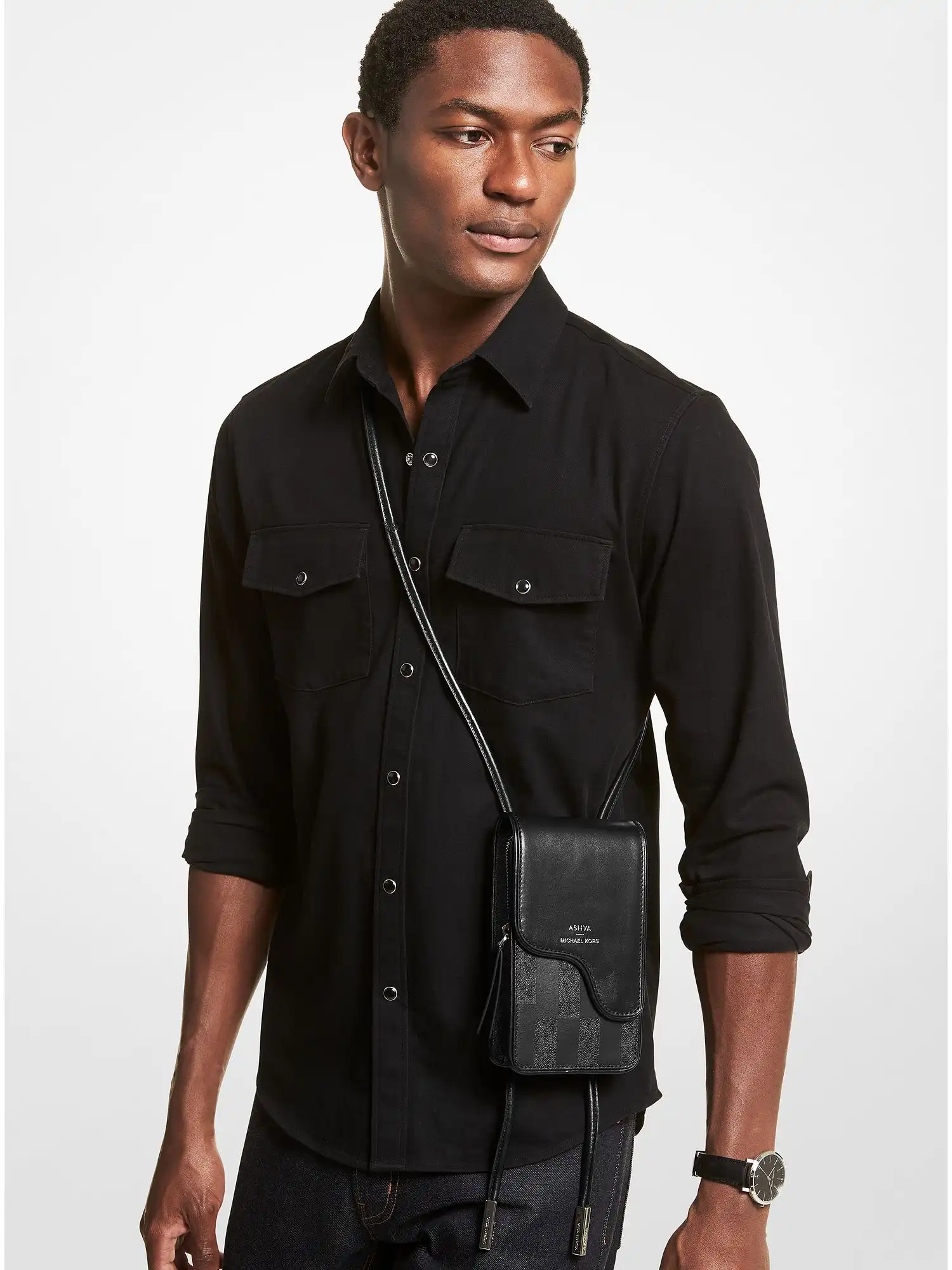 ashya x michael kors saga signature and leather bolo bag black combo